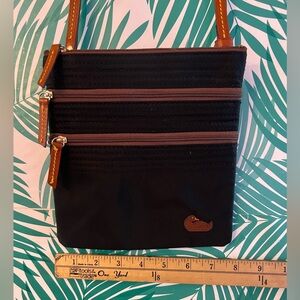 Dooney and Bourke cross body canvas bag with pink lining